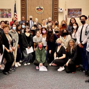 STT with Board Members, Admin, and Ethnic Studies April 2022: Gabrielle with Student Think Tank members alongside PUSD’s Board of Education, PUSD administration, Ethnic Studies team, and STT facilitator, Sehba Sarwar, after making the Student Think Tank’s first presentation at PUSD’s Board of Education’s monthly meeting